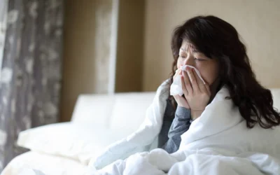 An educational infographic titled "The Cicada in the Room: Navigating the 2026 Spring Viral Surge" featuring a central cicada/virus hybrid illustration. The graphic includes panels on symptom tracking (fever, congestion), preventative measures (masking, hygiene), and managing illness via telehealth and home testing.