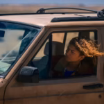 Cast of the TV series Euphoria in a dramatic, neon-lit scene reflecting the show’s intense tone and growing complexity on and off screen