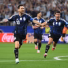 Argentina vs Jordan:Argentina players celebrate after defeating Jordan 3-1 to complete a perfect FIFA World Cup group stage campaign.