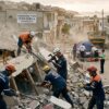 Rescue workers search through collapsed buildings after the Venezuela earthquake 2026.